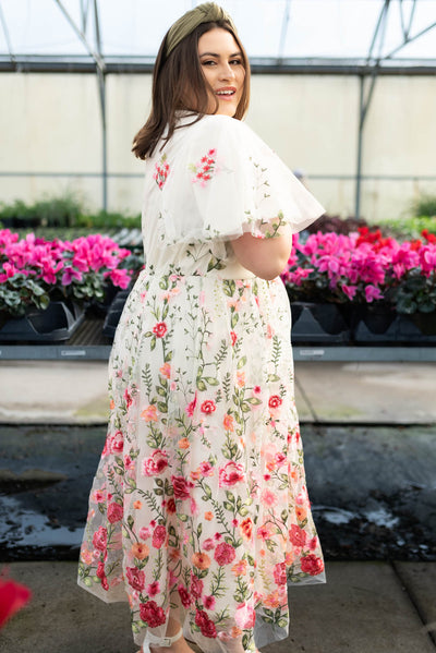 Side view of the plus size pink embroidered mesh dress