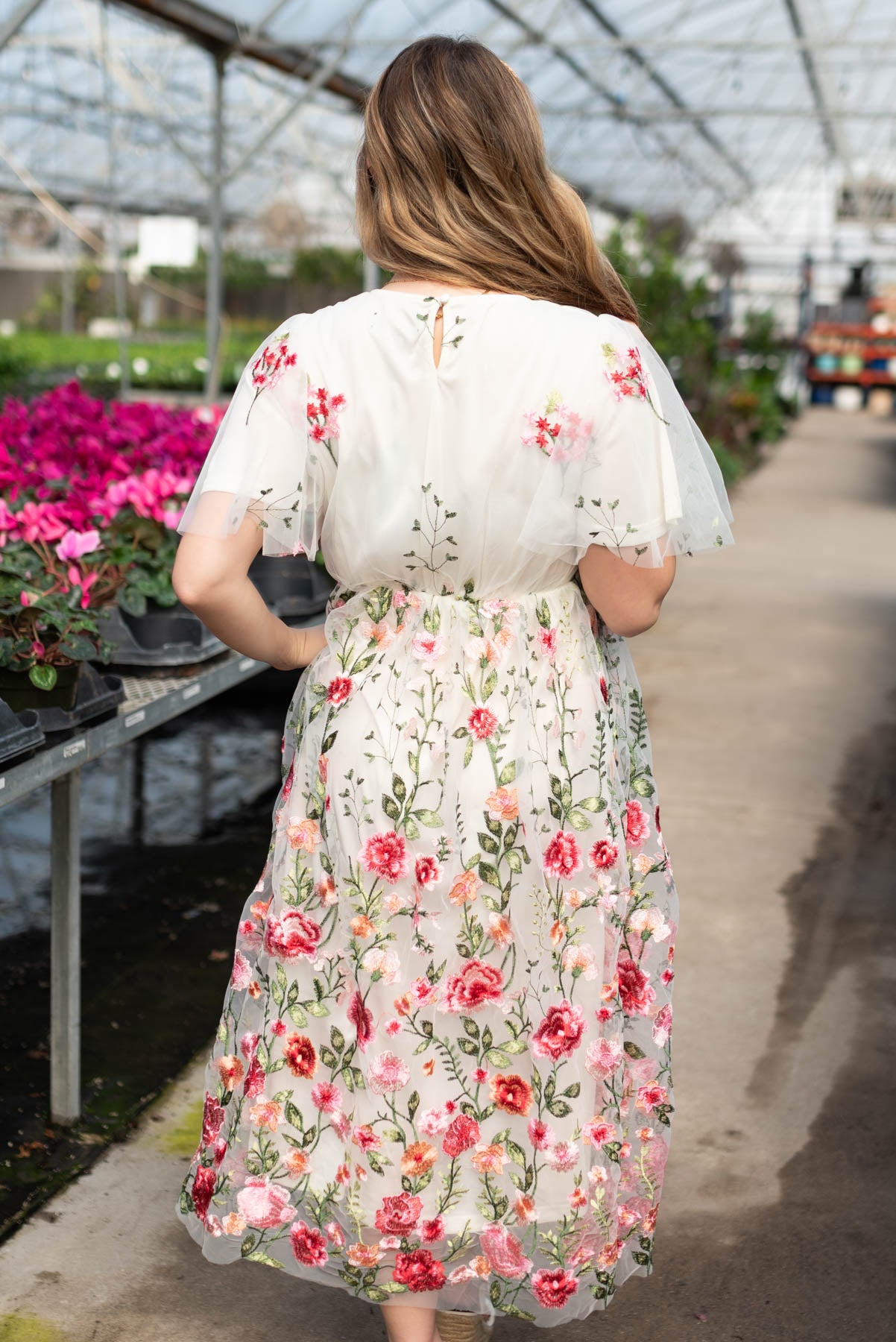 Back view of the pink embroidered mesh dress