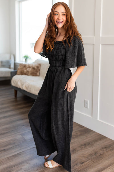 Side view of the charcoal wide leg jumpsuit