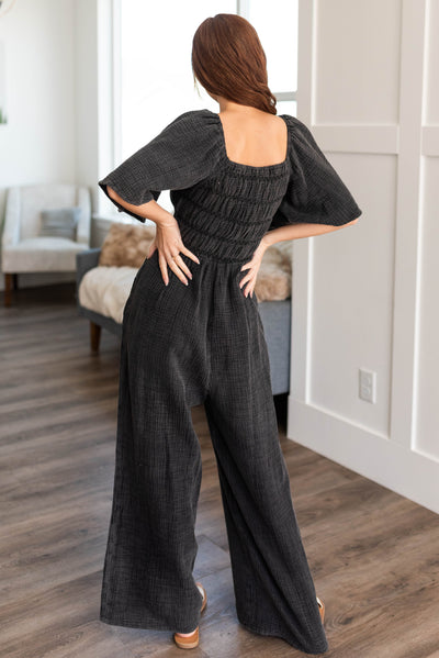 Back view of the charcoal wide leg jumpsuit