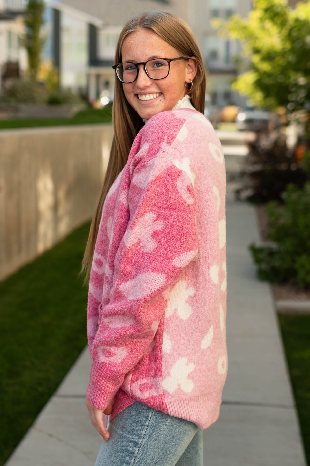 Side view of a pink cardigan