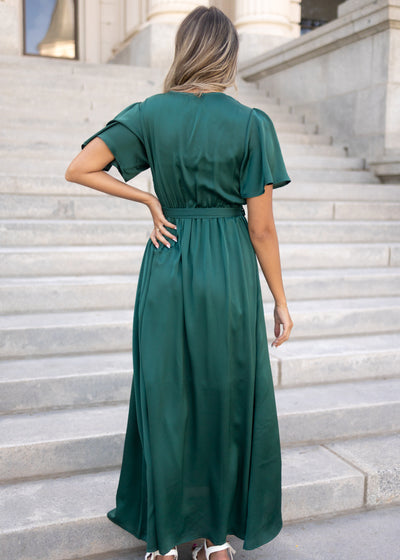 Back view of a short sleeve hunter green dress