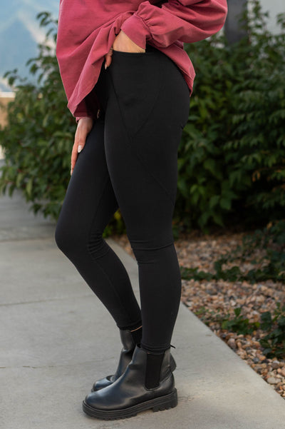 Side view of black leggings