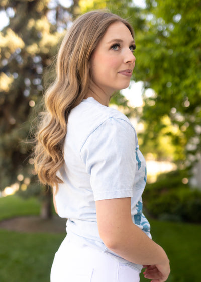 Side view of a desert night blue tee