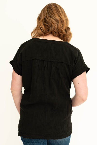 Back view of a gauze black top