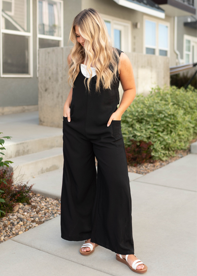 Black jumpsuit with wide legs and pockets