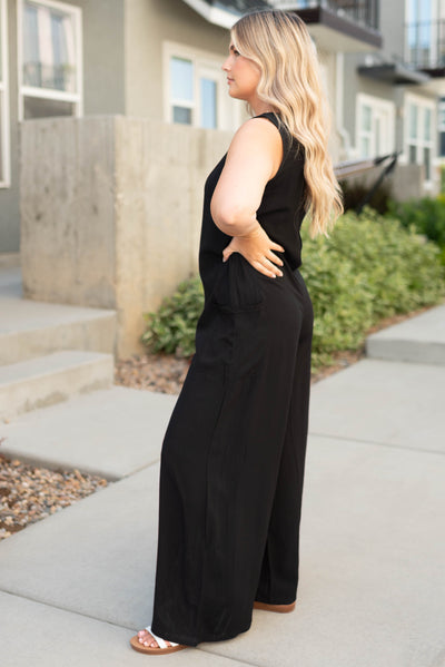 Side view of a black jumpsuit