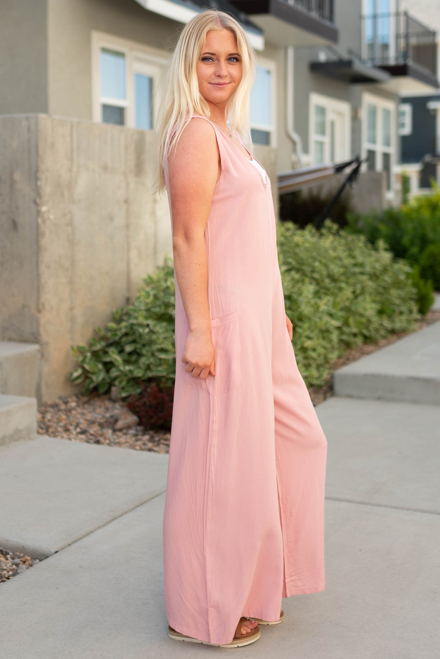 Side view of a pink jumpsuit