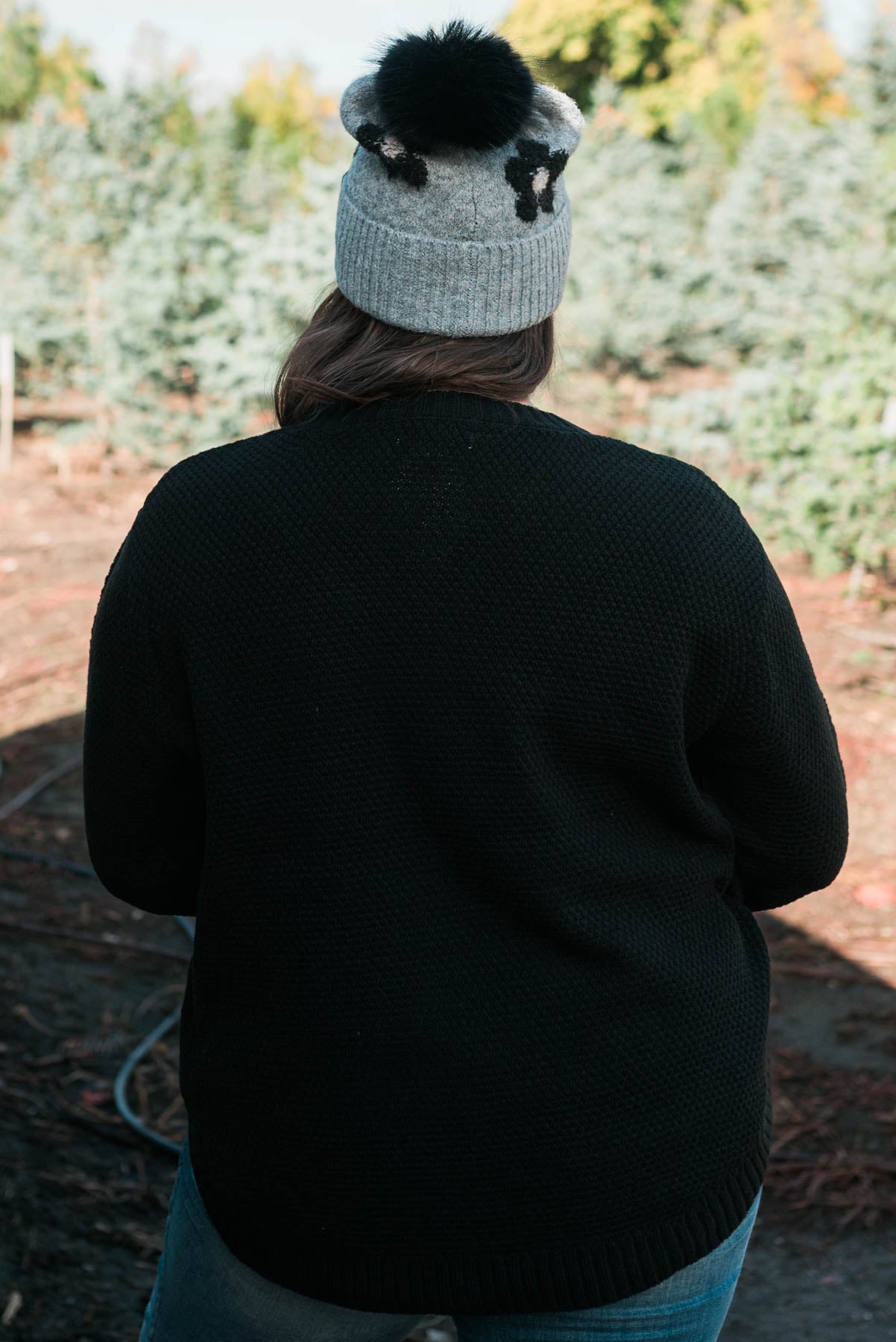 Back view of a plus size long sleeve sweater