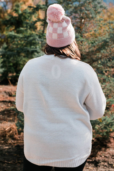 Back view of a plus size bone sweater
