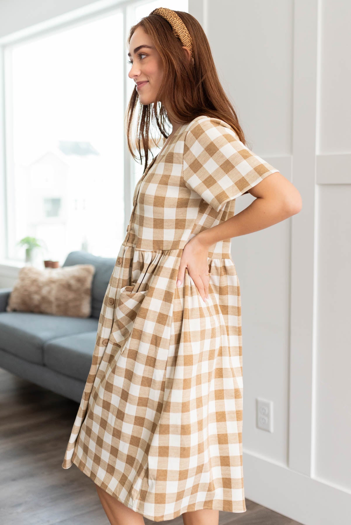 Side view of the camel button down dress