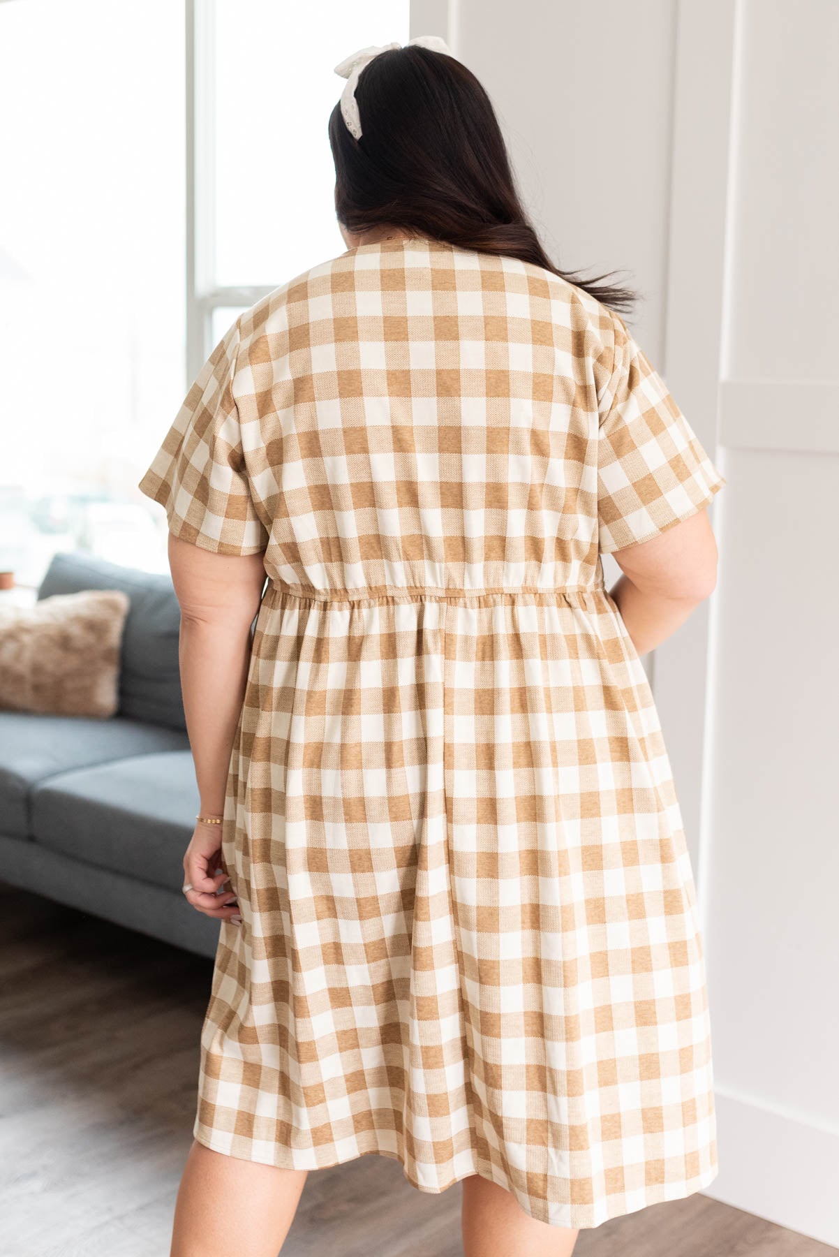 Back view of the plus size camel button down dress