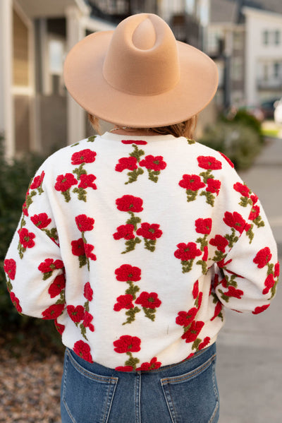 Back view of a fleece flowered sweater