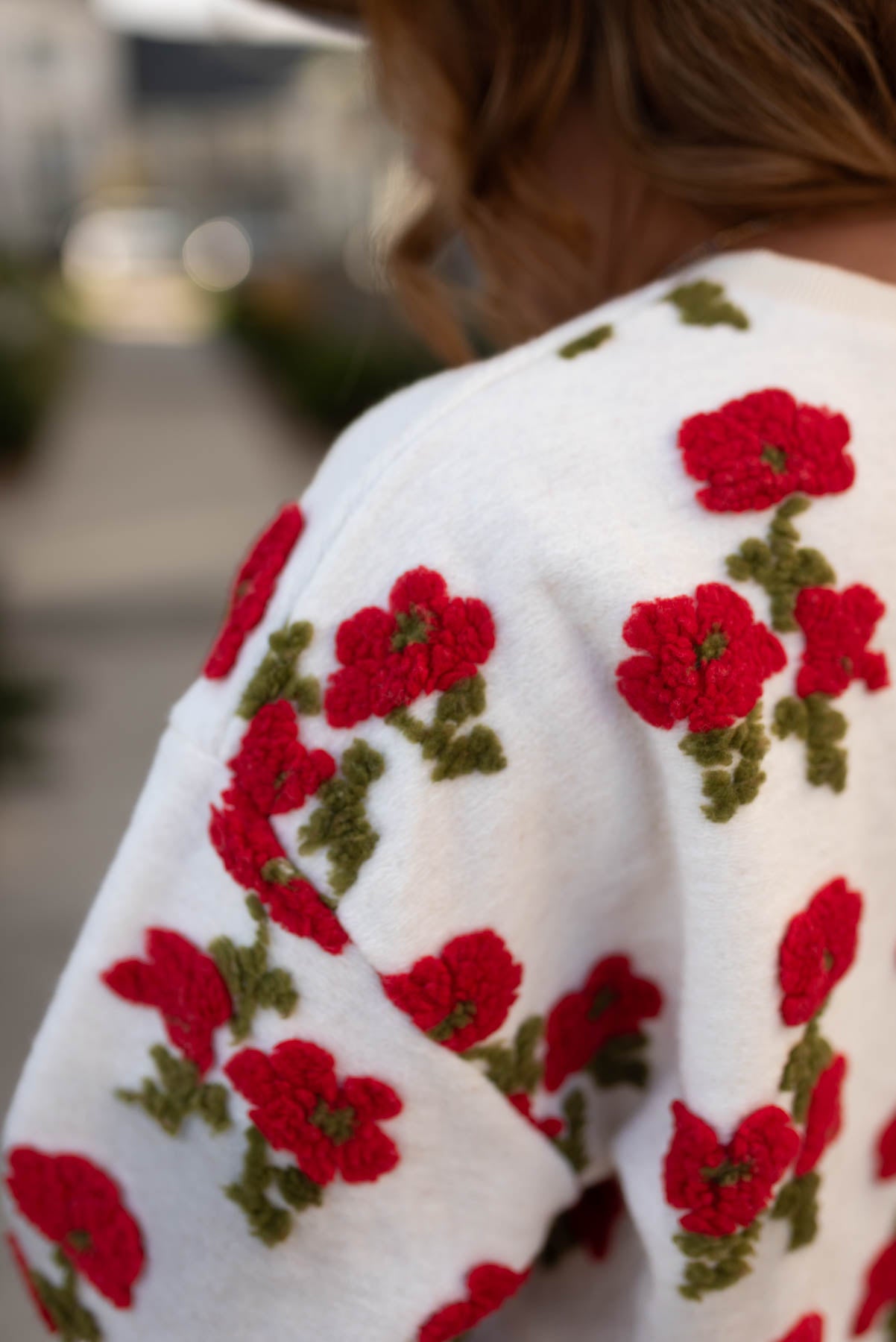 Close up view of the fleece flowered sweater