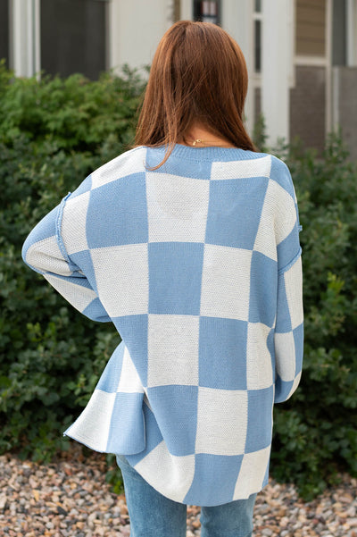 Back view of a blue cardigan