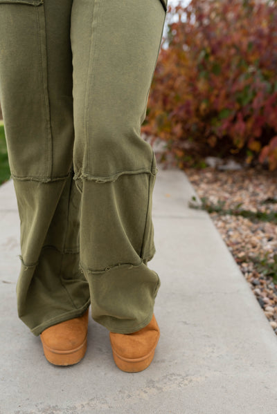 Knit olive pants with outside stitching