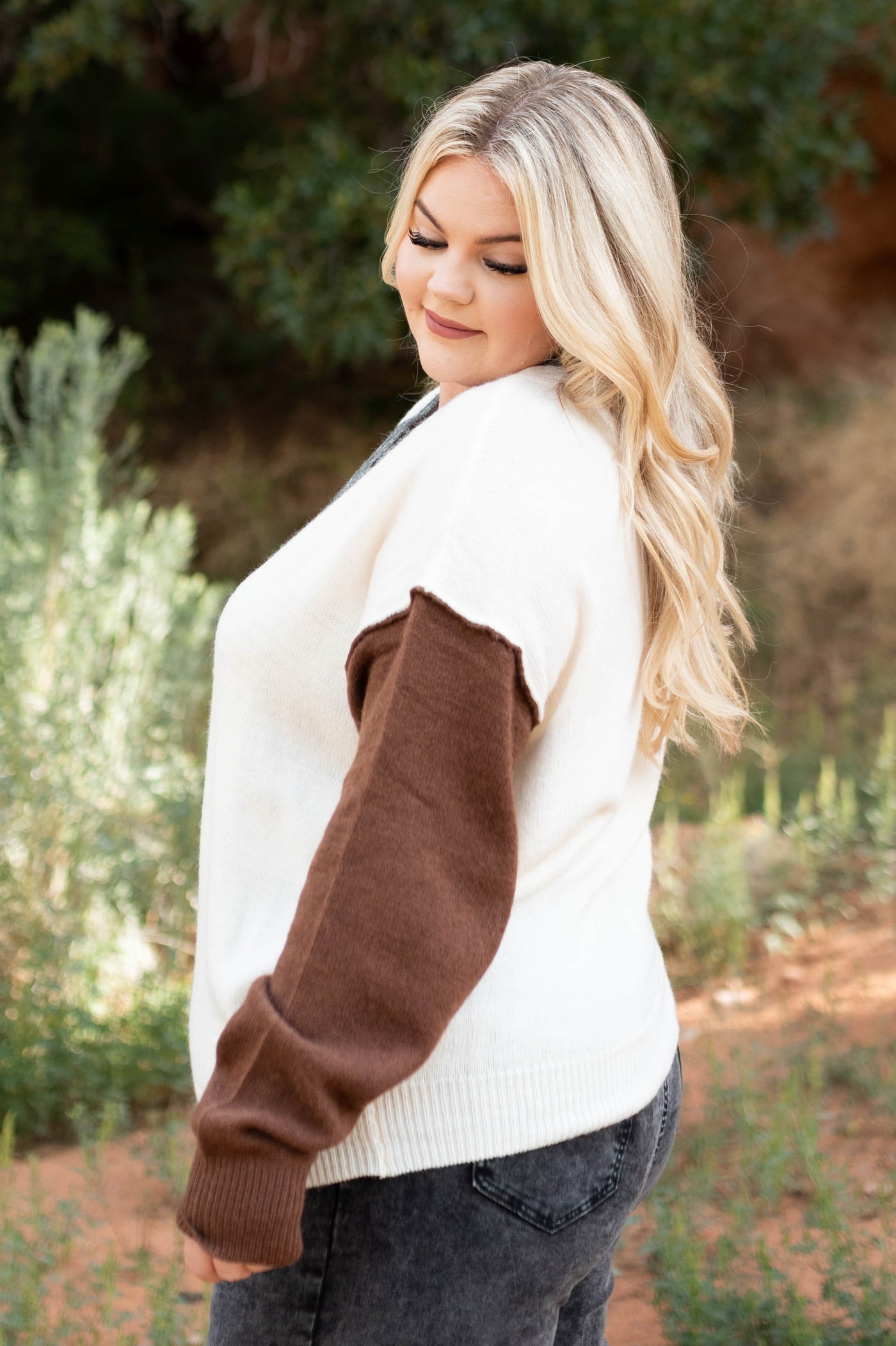 Side view of a oatmeal sweater