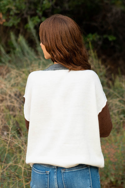 Back view of a oatmeal sweater