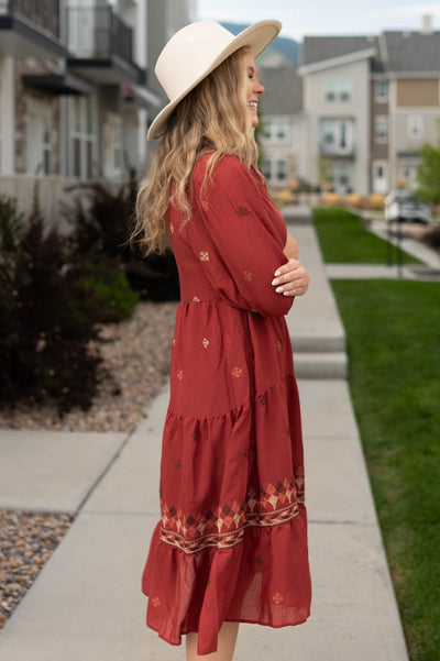 Side view of a dark terracotta dress