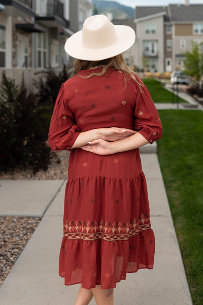 Back view of a dark terracotta dress