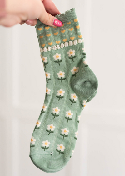 Green heart flower socks with white flowers and yellow hearts