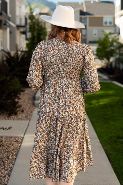 Back view of a chestnut floral dress
