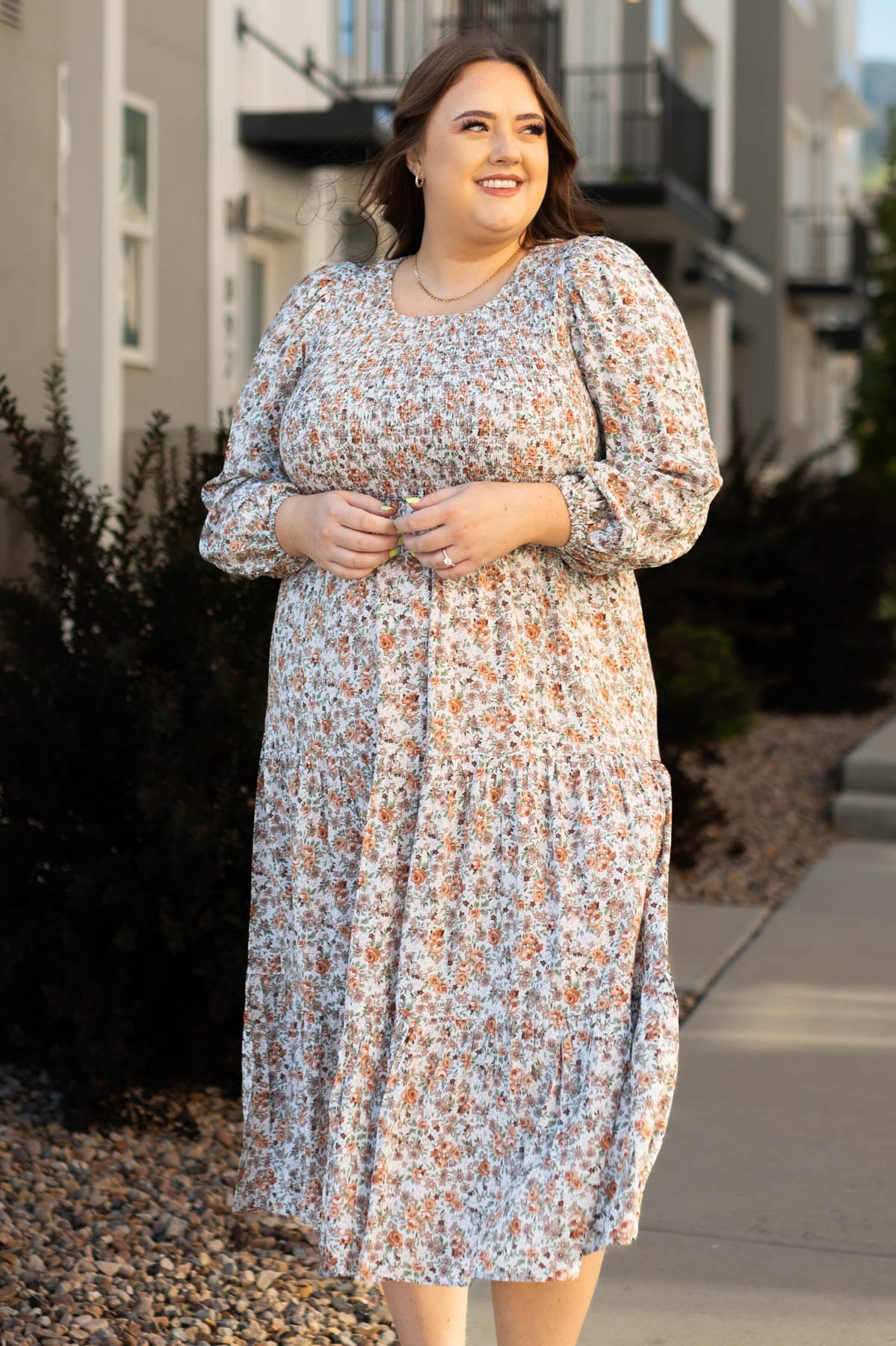 Taupe floral dress with smocked bodice and long sleeves