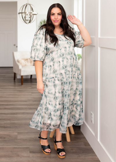 Plus size green floral dress with high waist and tiered skirt
