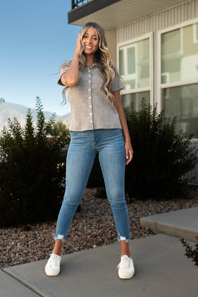 Short sleeve heather gray top that buttons up and has a collar