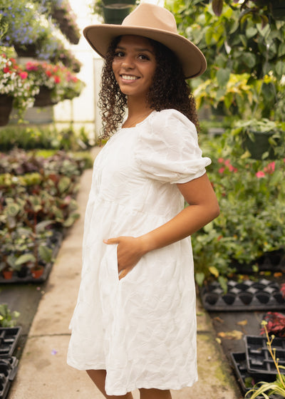 Side view of a short sleeve white dress