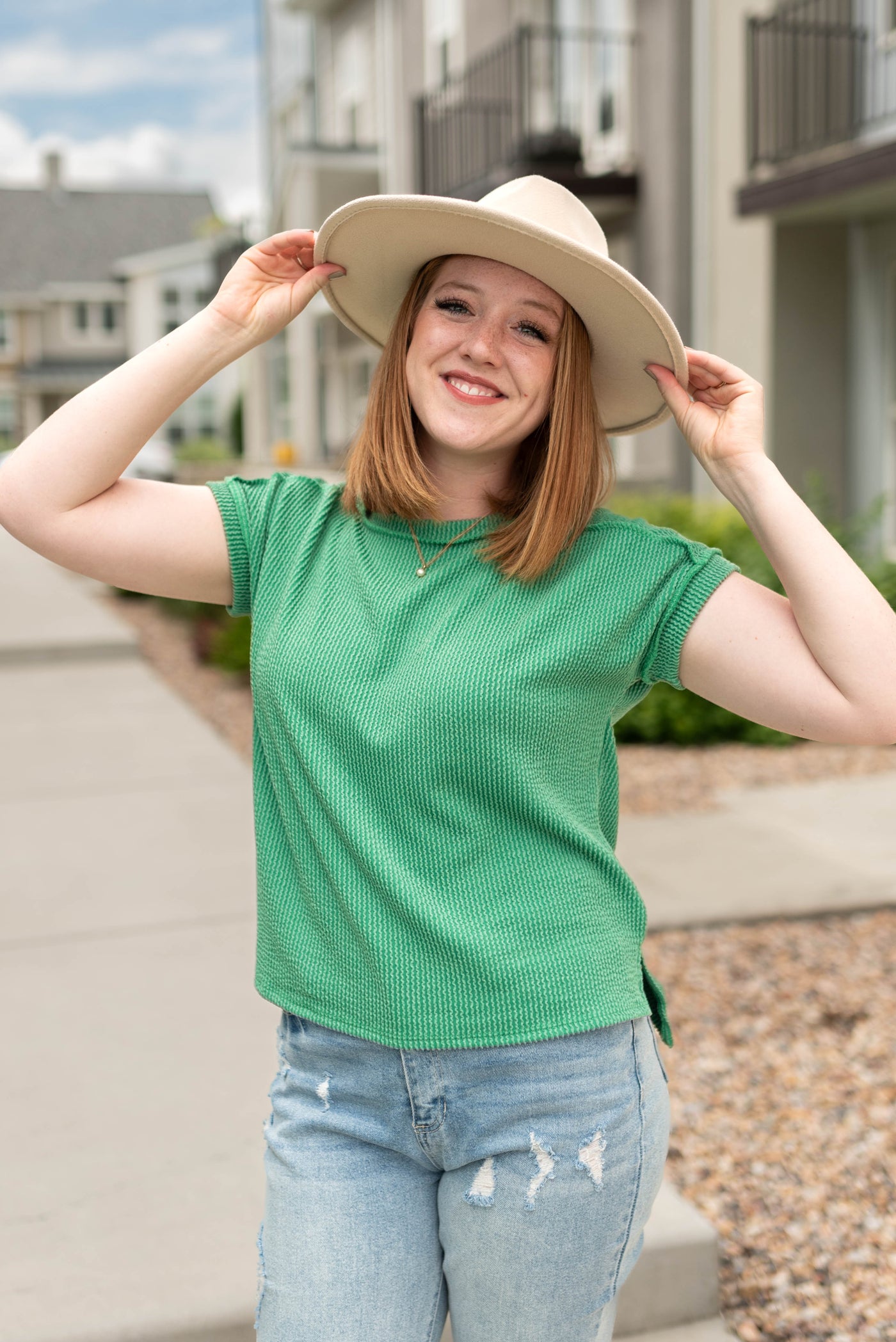 Kelly green top with short sleeves and waffle knit fabric