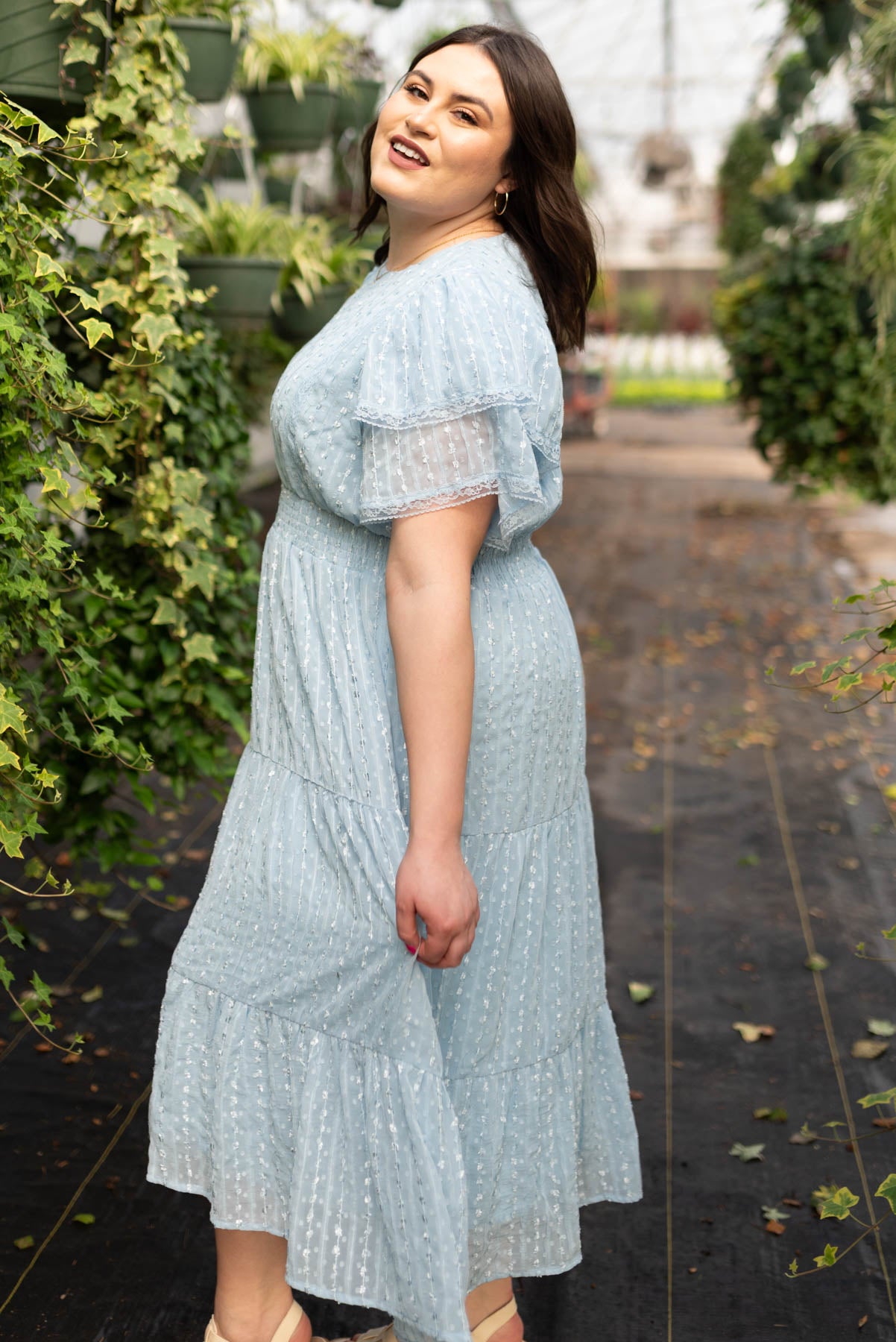Side view of the plus size light blue lace dress