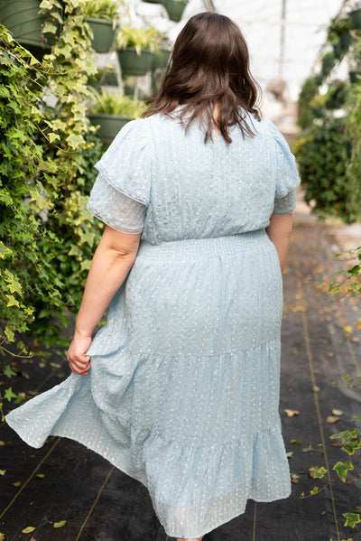 Back view of the plus size light blue lace dress