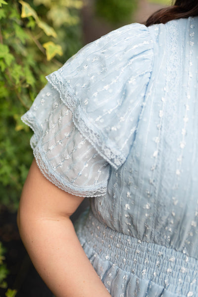 Close up of the sleeve on the plus size light blue lace dress
