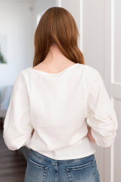 Back view of the the white twist sleeve top