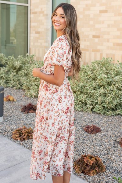 Side view of the cream floral tiered dress