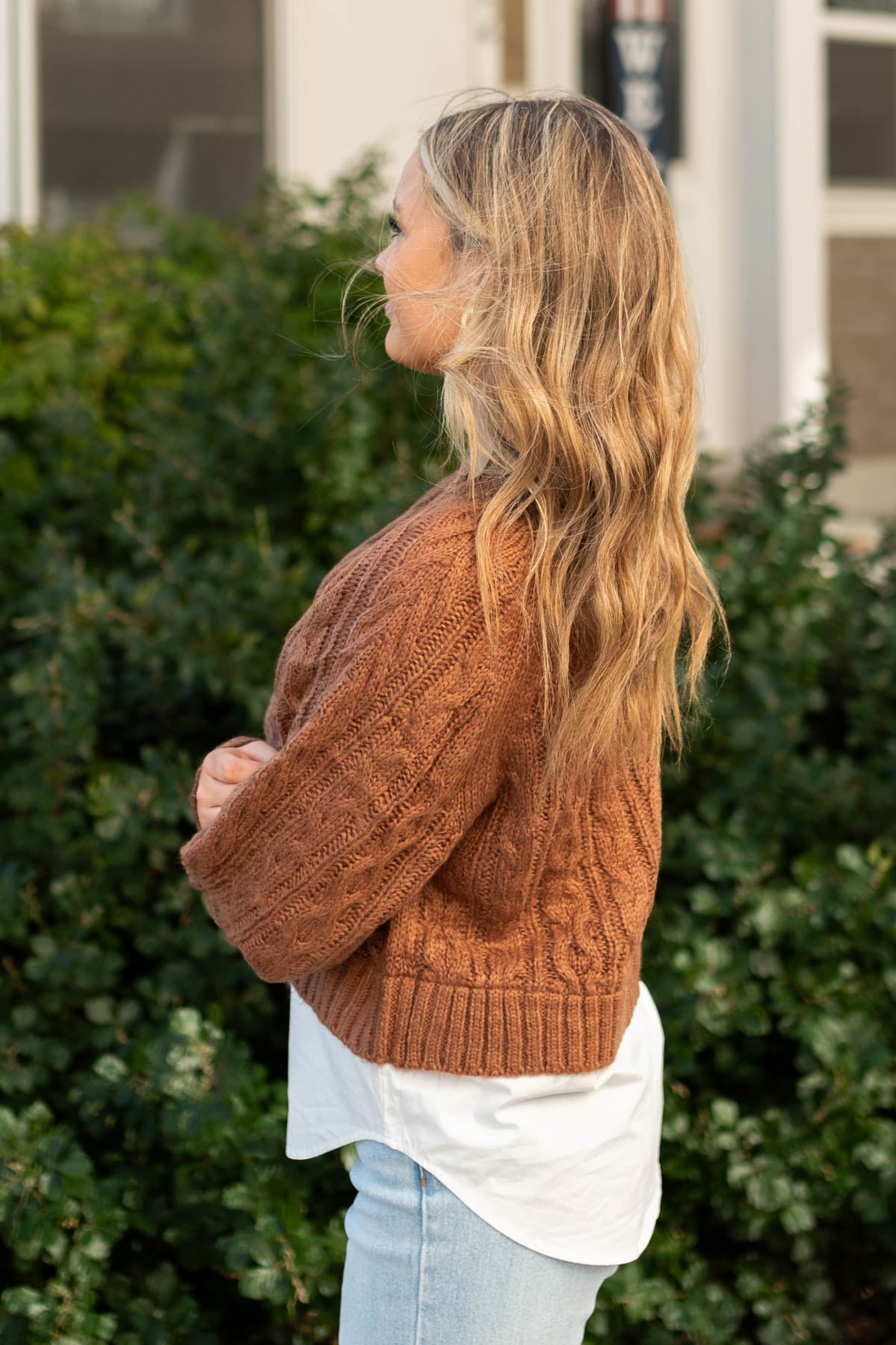 Side view of a camel sweater