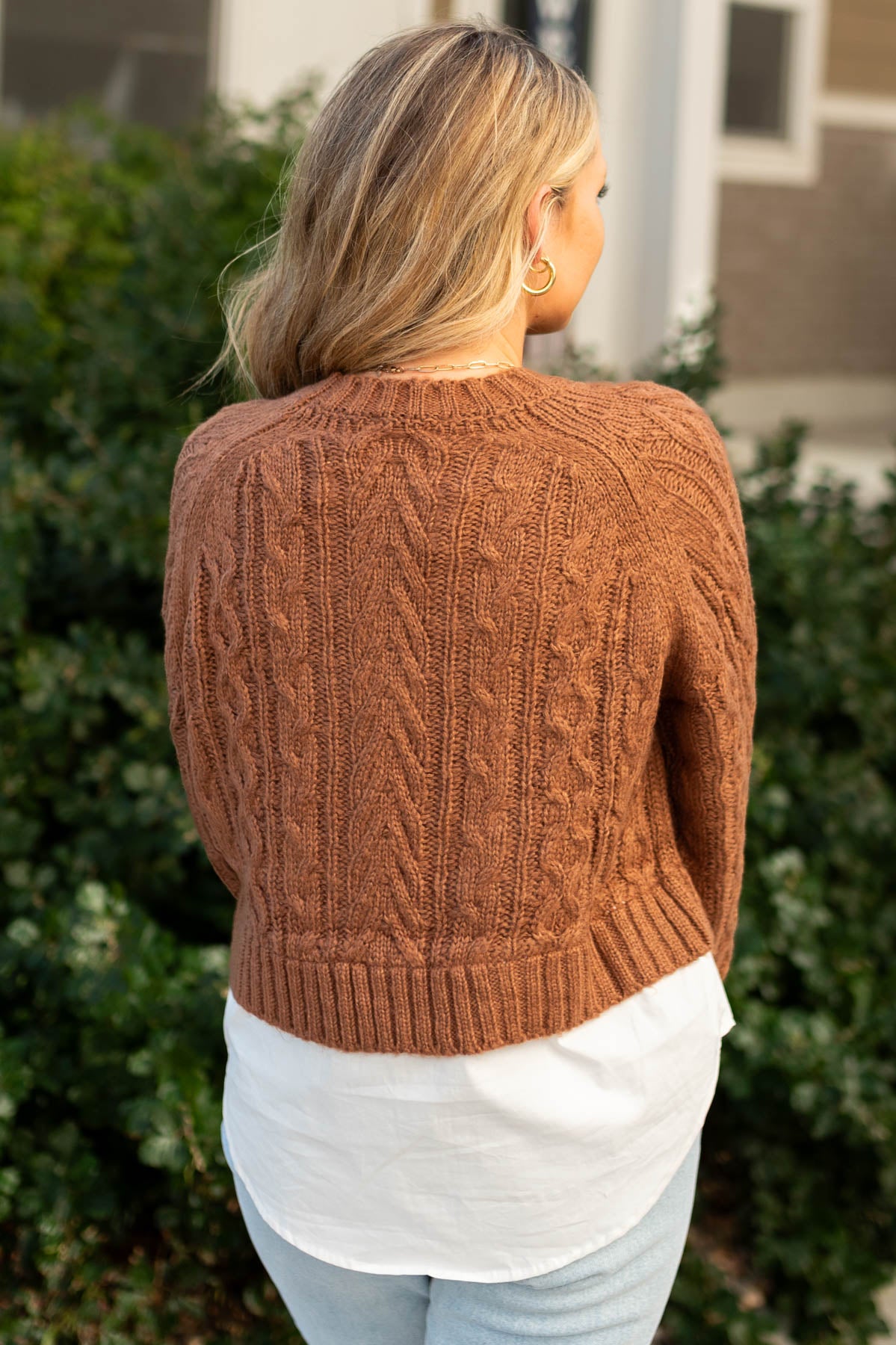 Back view of a camel sweater