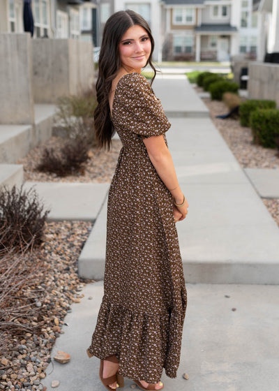 Side view of the brown flroal ruffle dress