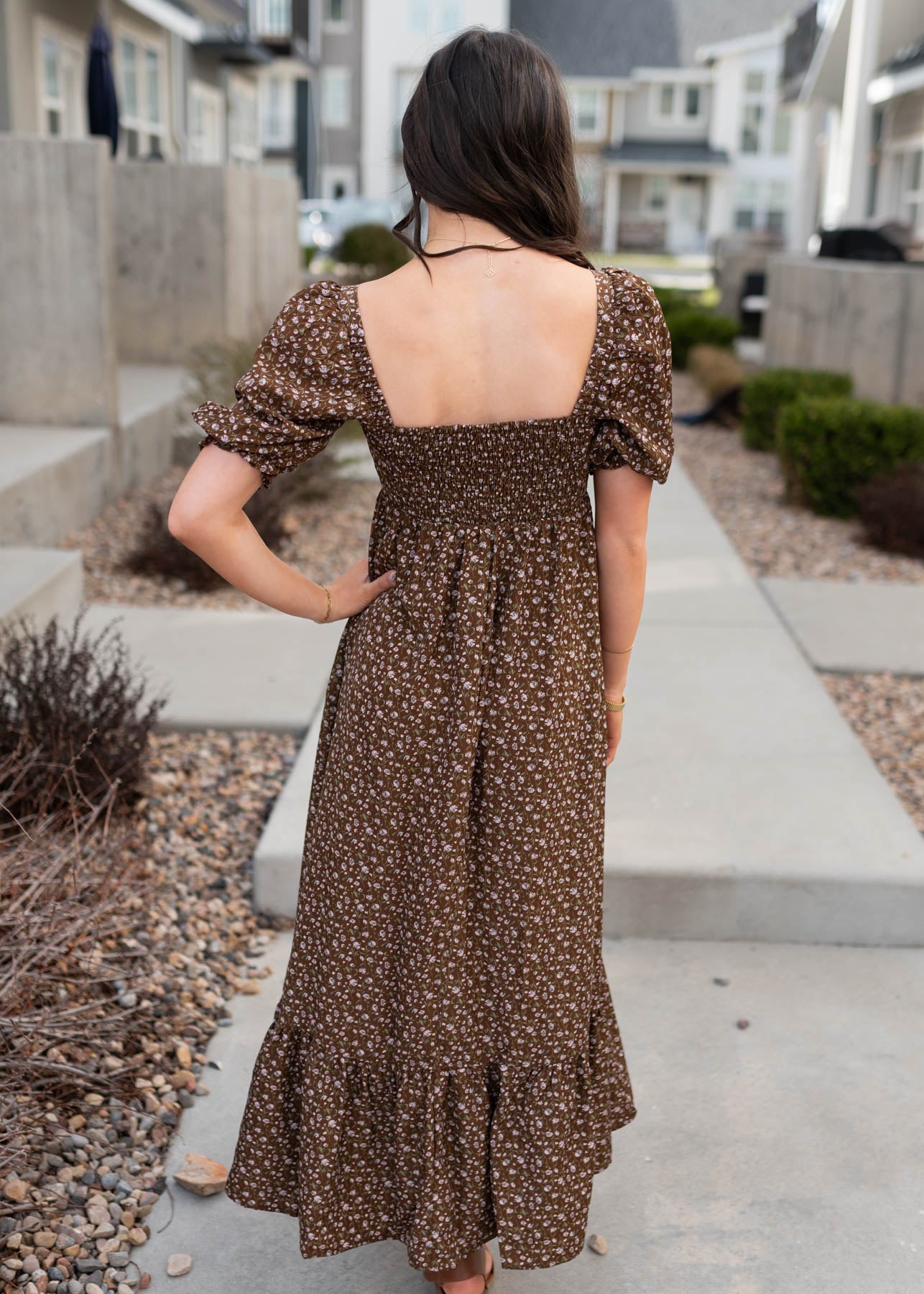 Back view of the brown floral ruffled dress