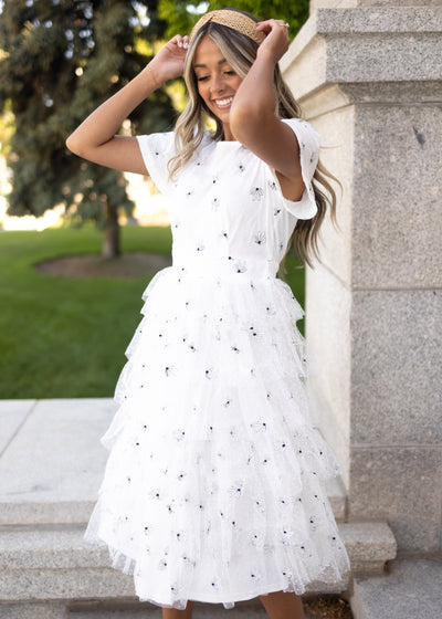 Short sleeve white tulle dress with ruffle skirt