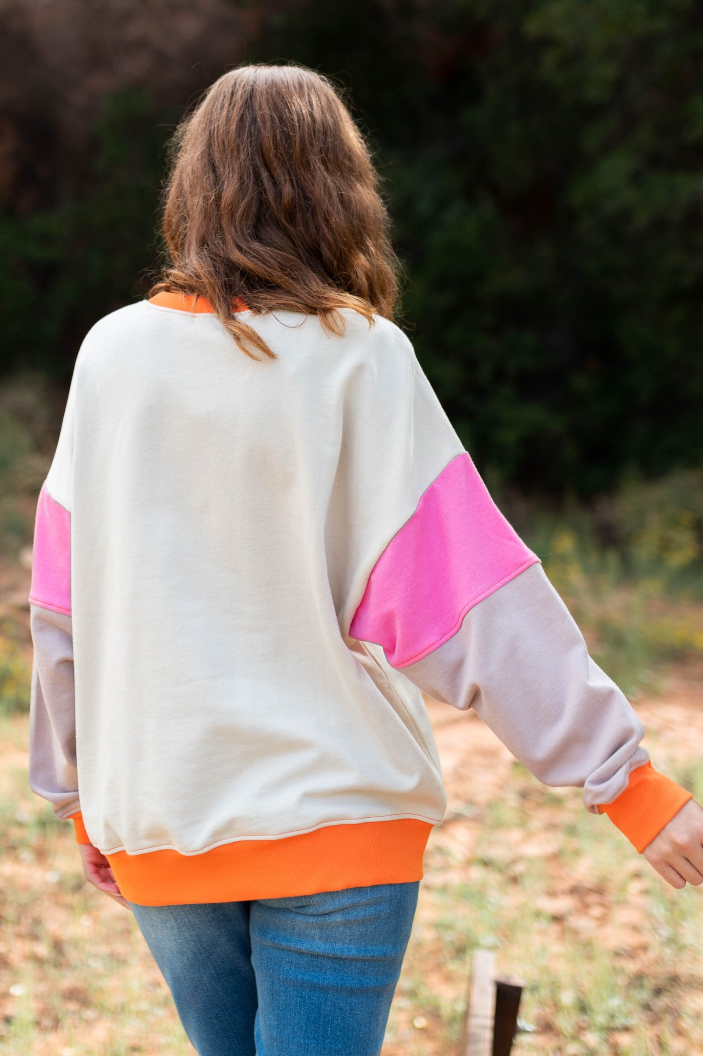 Back view of a pink pullover