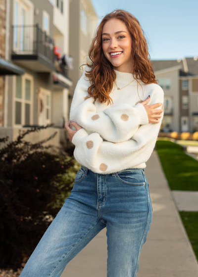 Long sleeve ivory sweater with tan polka dots