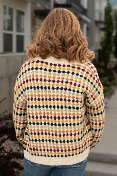 Back view of a cream cardigan
