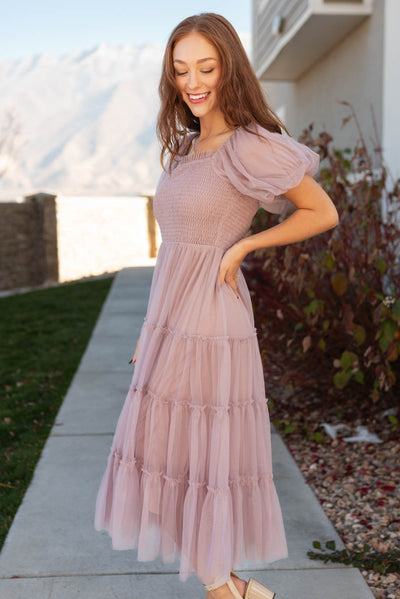 Side view of a light lavender puff sleeve mesh dress with smocked bodice