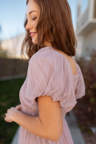 Sleeve view of the puff sleeve mesh dress