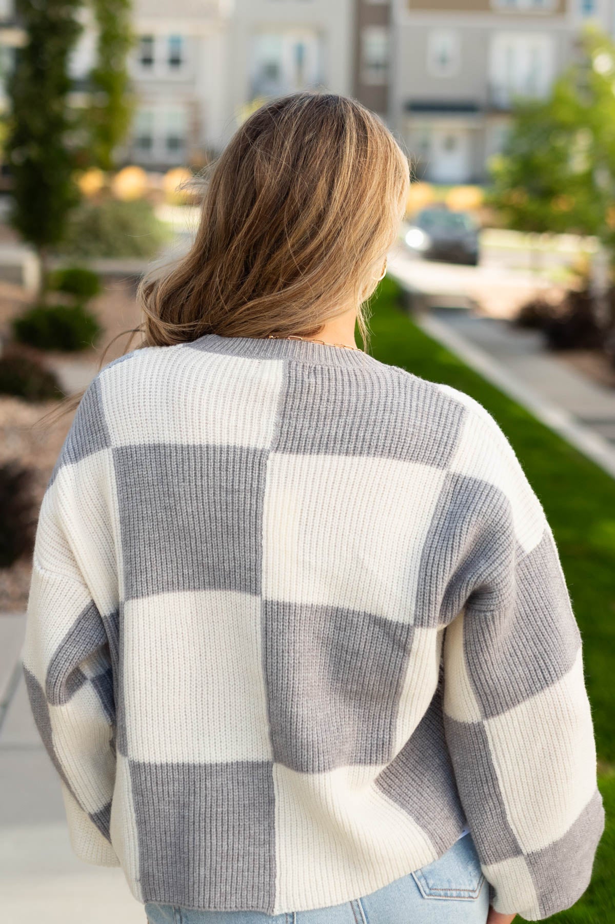 Back view of a grey sweater