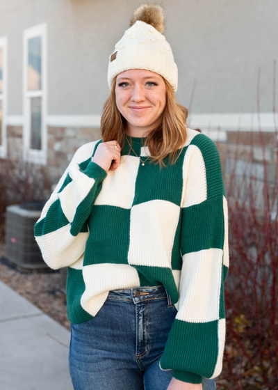 Hunter green sweater with a long sleeve checkered pattern