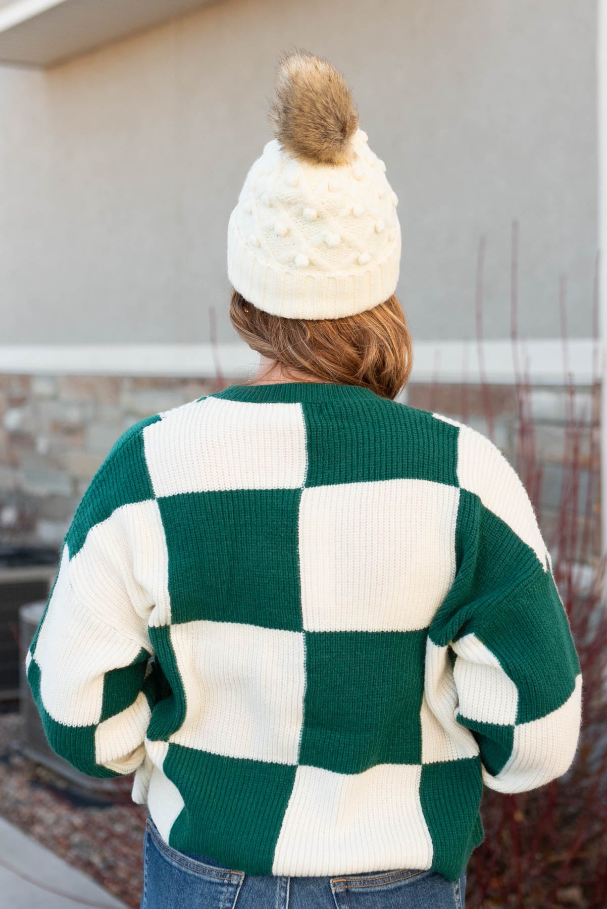 Back view of a hunter green sweater