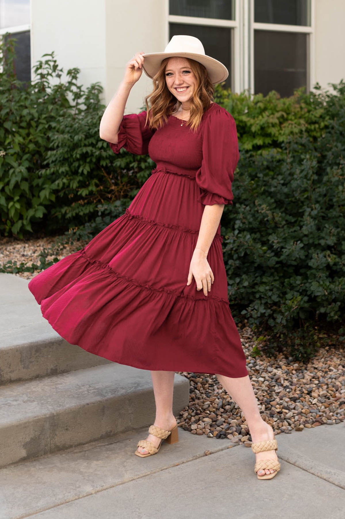 Deep red dress with a smocked bodice